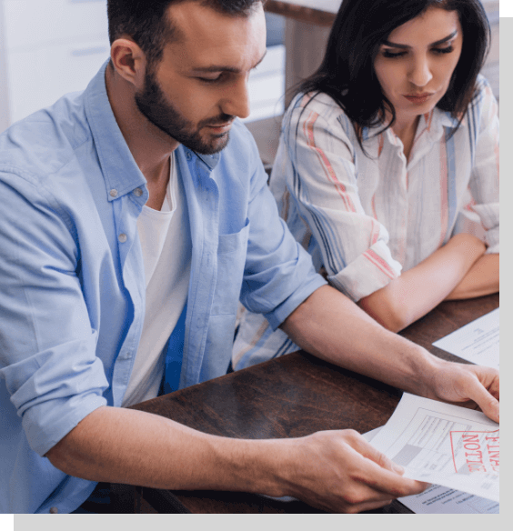 Couple looking over Chapter 13 bankruptcy paperwork